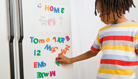 Boy with magnetic letters
